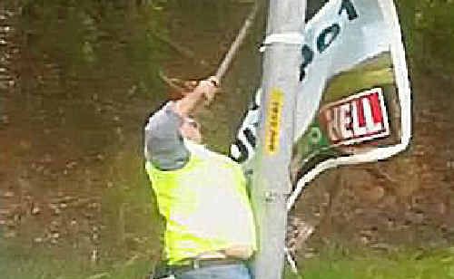 An RTA staffer removes the Nambucca banner. An RTA staffer removes the Nambucca banner.